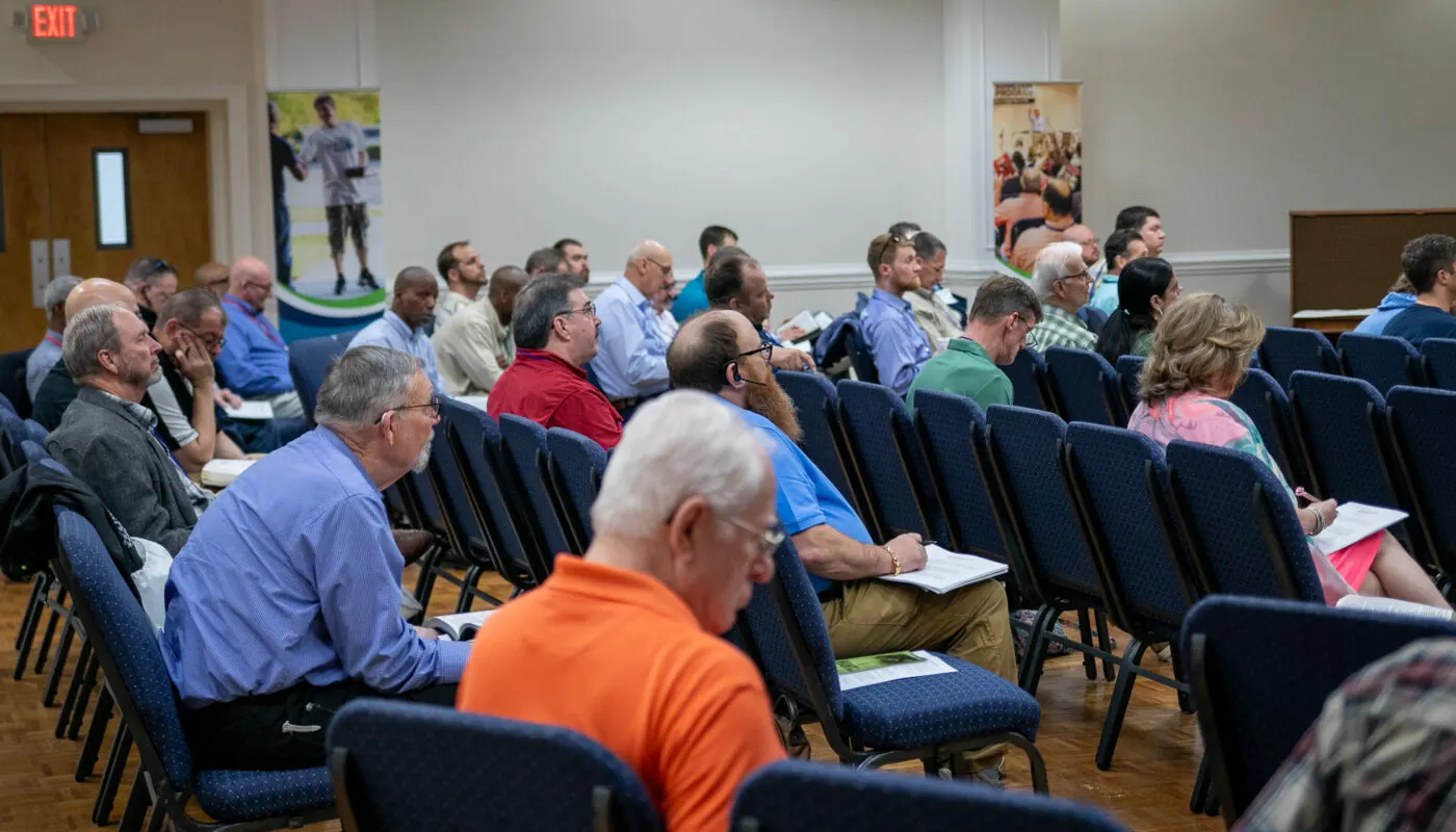 Adults receiving addiction recovery support at an RU meeting in Florence, South Carolina
